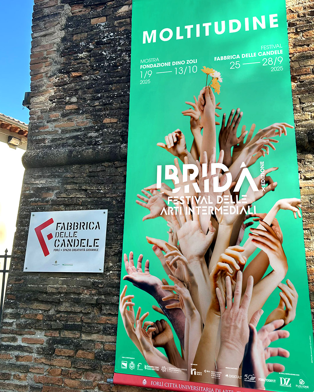 Poster mockup for Ibrida Festival 2025 – graphic design with multiple hands and flower