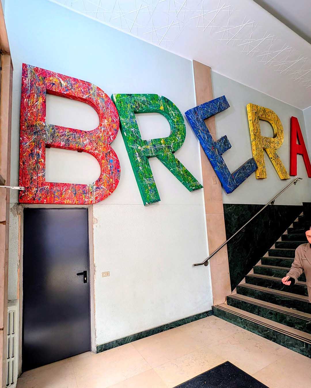 Main entrance of Brera Art High School with the large colorful BRERA sign
