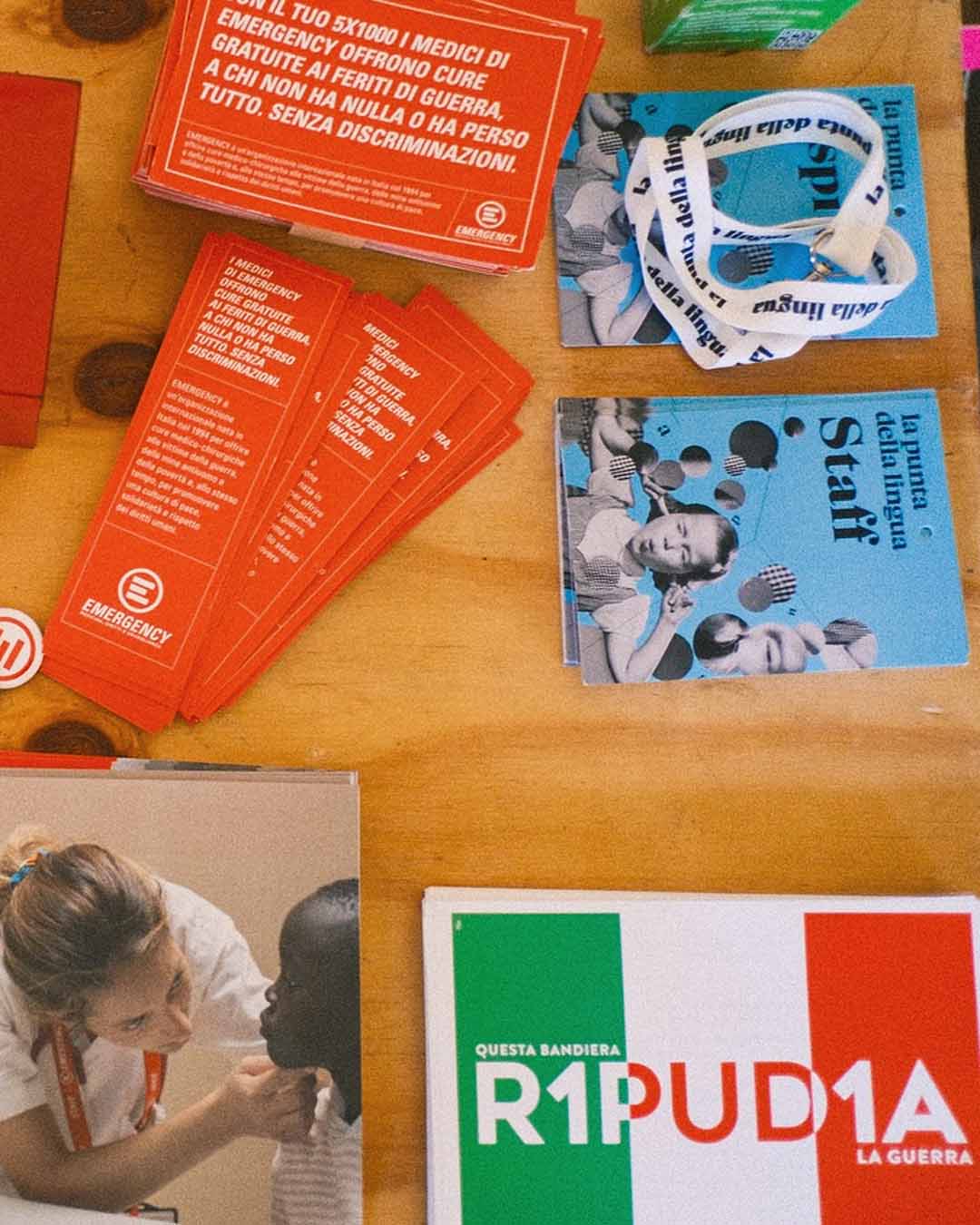 Festival merchandising stand featuring graphic applications of the identity