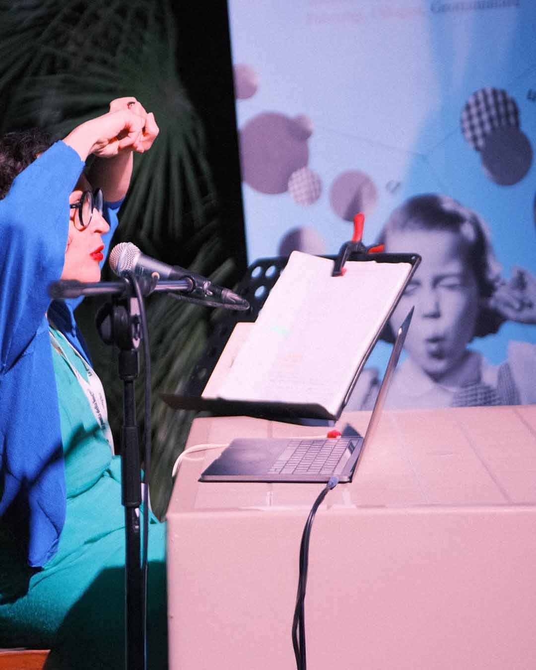 A poetry reading during the festival, with the audience in the background